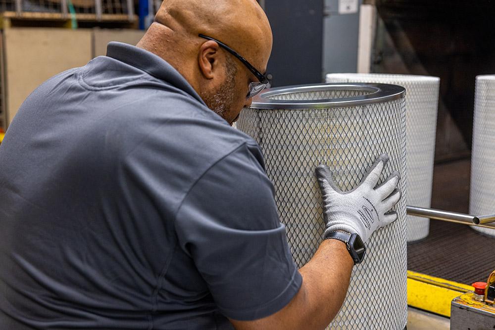 ProFleet team member working with a filter